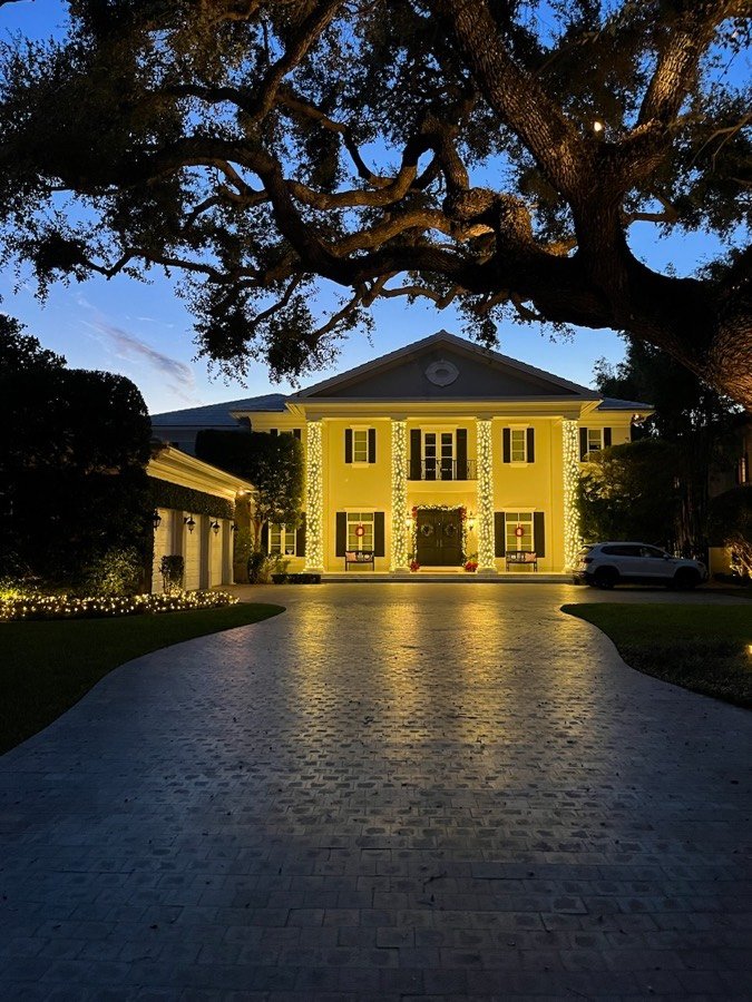 A twilight colonnade wrapped in warm white lights, Coral Gables